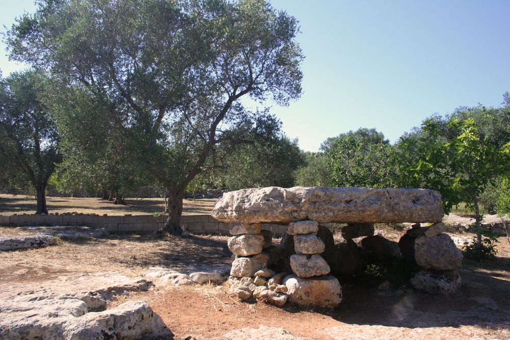 Prehistoric dolmen among olive trees, Apulia, Italy